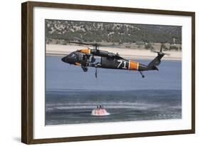 A U.S. Army Uh-60 Black Hawk Helicopter Collects Water from a Reservoir-null-Framed Photographic Print