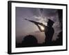 A U.S. Marine Honor Guard Rifleman Performs a Gun Salute During Sunset-Stocktrek Images-Framed Photographic Print