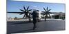 A U.S. Sailor Signals to a C-2A Greyhound Aircraft-null-Mounted Photographic Print