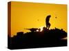 A U.S. Soldier Walks Atop His Armored Vehicle at Sunset-null-Stretched Canvas
