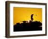 A U.S. Soldier Walks Atop His Armored Vehicle at Sunset-null-Framed Photographic Print