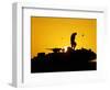 A U.S. Soldier Walks Atop His Armored Vehicle at Sunset-null-Framed Photographic Print