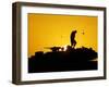 A U.S. Soldier Walks Atop His Armored Vehicle at Sunset-null-Framed Photographic Print