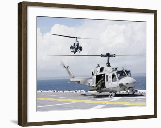 A UH-1N Huey And An AH-1W Super Cobra Land On Flight Deck of USS Essex-Stocktrek Images-Framed Photographic Print