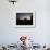 A UH-60 Black Hawk Crew Carry Out a Mission Brief at Sunset-null-Framed Photographic Print displayed on a wall