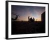 A UH-60 Black Hawk Crew Carry Out a Mission Brief at Sunset-null-Framed Photographic Print