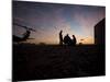A UH-60 Black Hawk Crew Carry Out a Mission Brief at Sunset-null-Mounted Photographic Print