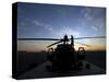 A UH-60 Black Hawk Helicopter on the Flight Line at Sunset-null-Stretched Canvas