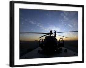 A UH-60 Black Hawk Helicopter on the Flight Line at Sunset-null-Framed Photographic Print