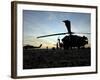 A UH-60 Black Hawk Helicopter on the Flight Line at Sunset-null-Framed Photographic Print