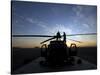 A UH-60 Black Hawk Helicopter on the Flight Line at Sunset-null-Stretched Canvas