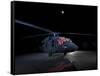 A UH-60 Black Hawk Helicopter Parked on the Flight Line under a Full Moon-null-Framed Stretched Canvas