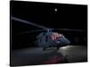 A UH-60 Black Hawk Helicopter Parked on the Flight Line under a Full Moon-null-Stretched Canvas