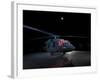 A UH-60 Black Hawk Helicopter Parked on the Flight Line under a Full Moon-null-Framed Photographic Print