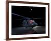 A UH-60 Black Hawk Helicopter Parked on the Flight Line under a Full Moon-null-Framed Photographic Print