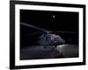 A UH-60 Black Hawk Helicopter Parked on the Flight Line under a Full Moon-null-Framed Photographic Print