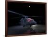 A UH-60 Black Hawk Helicopter Parked on the Flight Line under a Full Moon-null-Framed Photographic Print