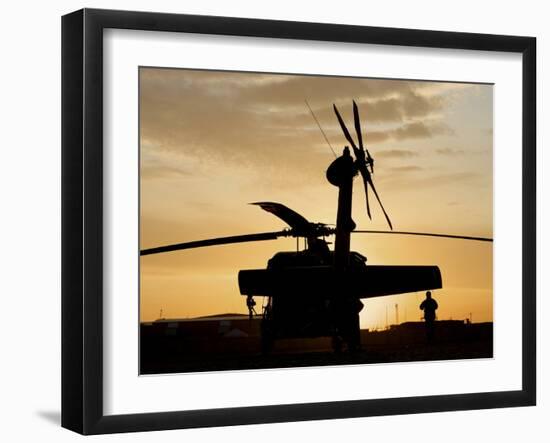A UH-60L Black Hawk Helicopter Silhouetted by the Setting Sun-null-Framed Premium Photographic Print