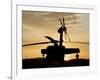 A UH-60L Black Hawk Helicopter Silhouetted by the Setting Sun-null-Framed Photographic Print