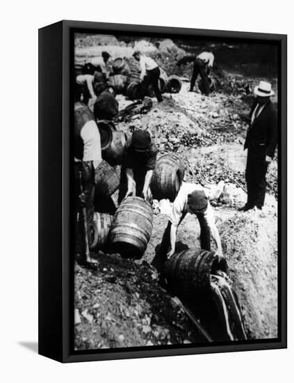 A Us Federal Agent Oversees the Destruction of Beer Kegs During the American Prohibition Era…-American Photographer-Framed Stretched Canvas