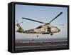 A US Navy SH-60F Seahawk Hovers Above the Flight Deck of USS Eisenhower-Stocktrek Images-Framed Stretched Canvas