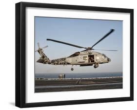 A US Navy SH-60F Seahawk Hovers Above the Flight Deck of USS Eisenhower-Stocktrek Images-Framed Photographic Print