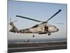 A US Navy SH-60F Seahawk Hovers Above the Flight Deck of USS Eisenhower-Stocktrek Images-Mounted Photographic Print