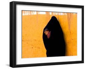 A Veiled Woman Carries Her Child Through the Streets of Erfoud-null-Framed Photographic Print