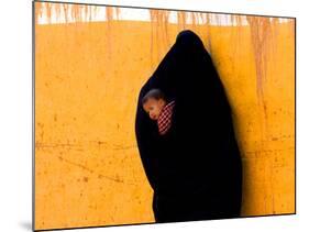 A Veiled Woman Carries Her Child Through the Streets of Erfoud-null-Mounted Photographic Print