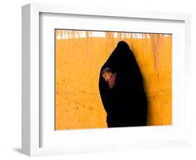 A Veiled Woman Carries Her Child Through the Streets of Erfoud-null-Framed Photographic Print