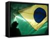 A Vendor Walks Behind a Big Brazilian Flag-null-Framed Stretched Canvas