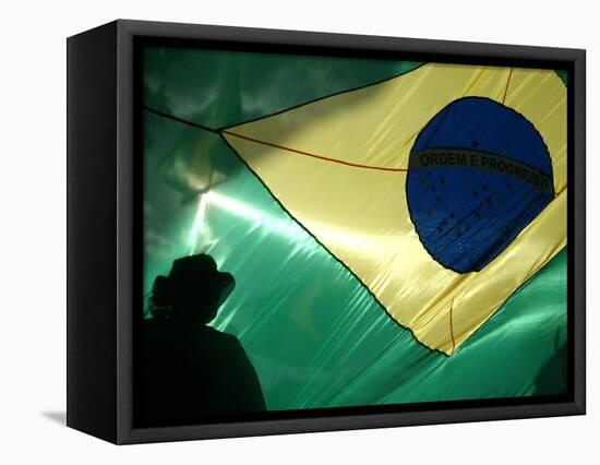 A Vendor Walks Behind a Big Brazilian Flag-null-Framed Stretched Canvas
