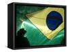 A Vendor Walks Behind a Big Brazilian Flag-null-Framed Stretched Canvas