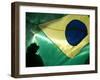 A Vendor Walks Behind a Big Brazilian Flag-null-Framed Photographic Print