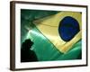 A Vendor Walks Behind a Big Brazilian Flag-null-Framed Photographic Print