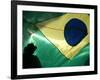 A Vendor Walks Behind a Big Brazilian Flag-null-Framed Photographic Print