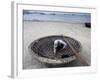 A Vietnamese Fisherman Does Repairs on His Basket Boat on a Beach-null-Framed Photographic Print