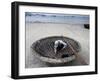 A Vietnamese Fisherman Does Repairs on His Basket Boat on a Beach-null-Framed Photographic Print