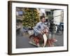 A Vietnamese Vendor Races Down a Street on a Motorbike Carrying a Kumquat Tree for Sale-null-Framed Photographic Print