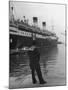 A View of a Sailor Looking at a Ship Docked in the City of Genoa-Carl Mydans-Mounted Premium Photographic Print