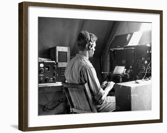 A View of a Soldier Using Communications Equipment During US Army Maneuvers-John Phillips-Framed Premium Photographic Print