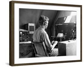 A View of a Soldier Using Communications Equipment During US Army Maneuvers-John Phillips-Framed Premium Photographic Print