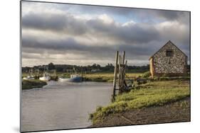 A view of boats moored in the creek at Thornham, Norfolk, England, United Kingdom, Europe-Jon Gibbs-Mounted Photographic Print