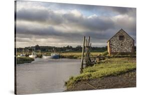 A view of boats moored in the creek at Thornham, Norfolk, England, United Kingdom, Europe-Jon Gibbs-Stretched Canvas