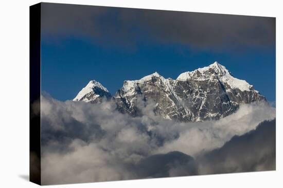 A view of Taboche through the clouds seen from Kongde in the Everest region, Nepal, Himalayas, Asia-Alex Treadway-Stretched Canvas