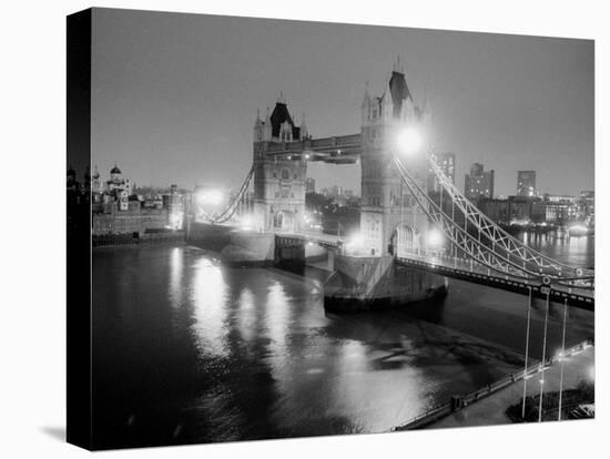 A View of Tower Bridge on the River Thames Illuminated at Night in London, April 1987-null-Stretched Canvas