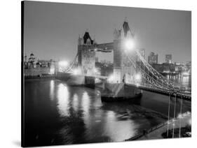 A View of Tower Bridge on the River Thames Illuminated at Night in London, April 1987-null-Stretched Canvas