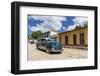 A vintage 1950's American car working as a taxi in the town of Trinidad, UNESCO World Heritage Site-Michael Nolan-Framed Photographic Print