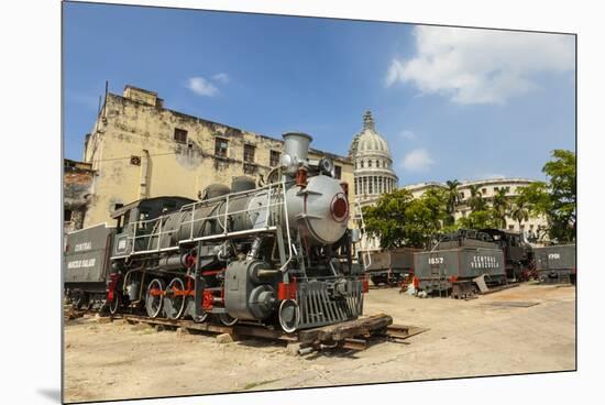 A Vintage Steam Train in a Restoration Yard with Dome of Former Parliament Building in Background-Sean Cooper-Mounted Premium Photographic Print