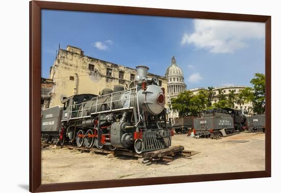 A Vintage Steam Train in a Restoration Yard with Dome of Former Parliament Building in Background-Sean Cooper-Framed Photographic Print